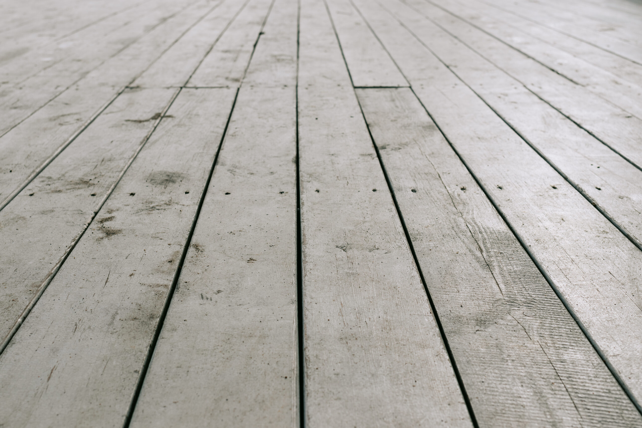 Old white wooden planks on the floor