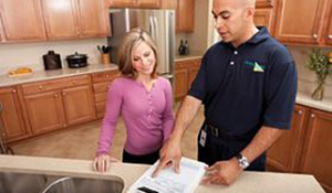 ServiceMaster employee speaking to a customer