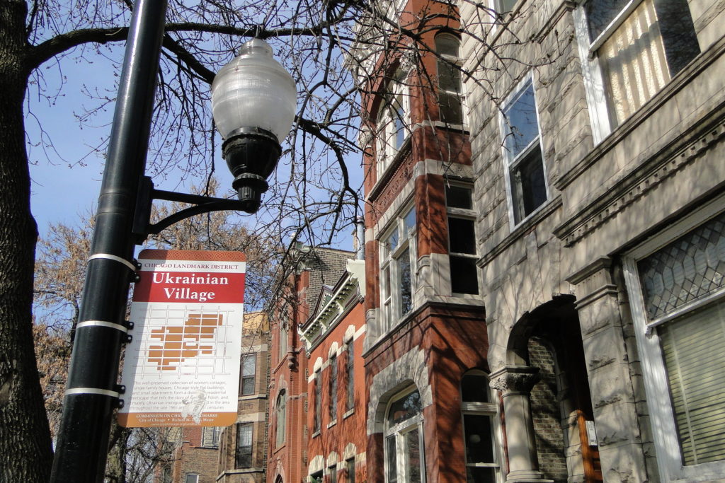 Ukrainian Village Neighborhood Street Sign on Lamp Post in Chicago.